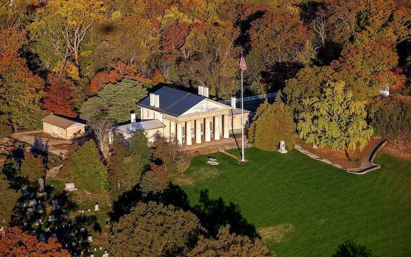 Aerial view of Arlington House surrounded by fall foliage.