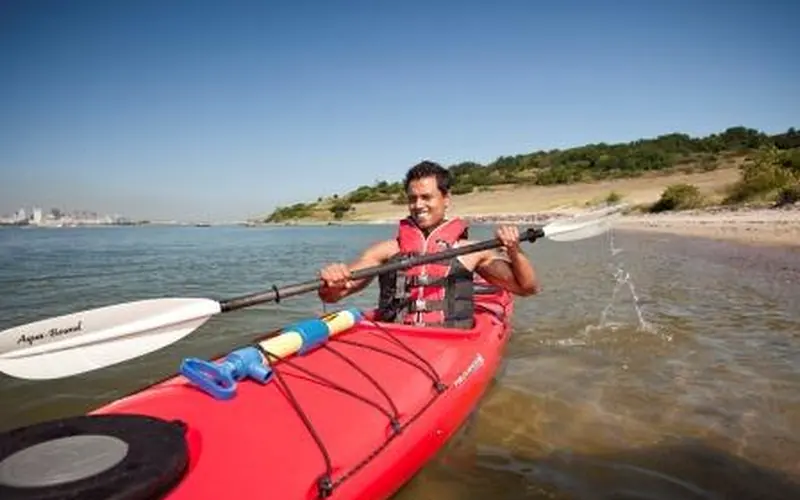 A man on a kayak in Boston Harbor