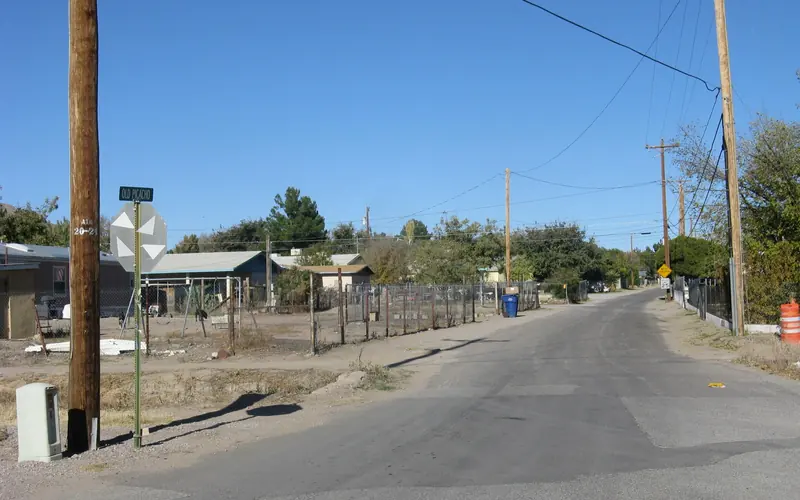 A neighborhood street lined with single story ranch homes.