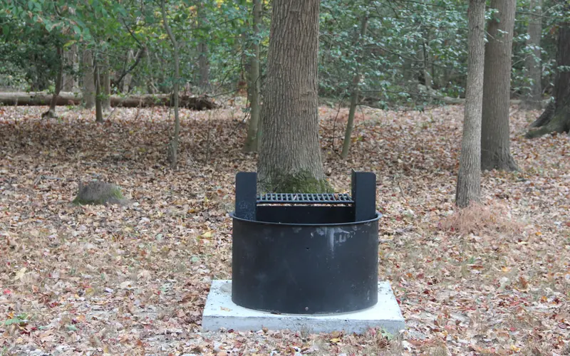 a round back grill with grill on top on a campsite in the Greenbelt Park campground