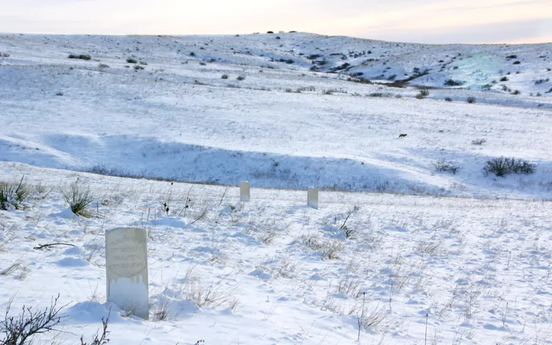 Headstone can still been seen even with the fresh snow that blankets the battlefield .