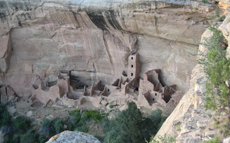 View of cliff dwelling from above a canyon