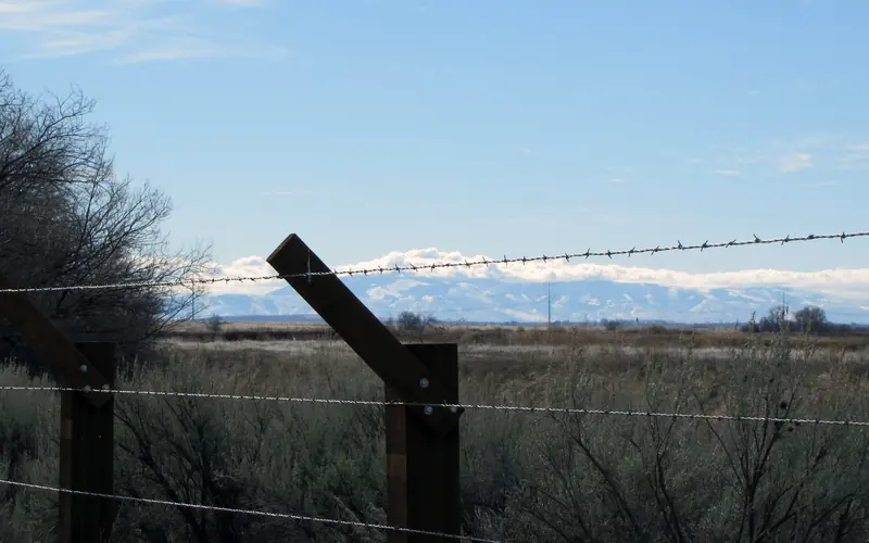 A view from Minidoka through the barbed wire fence.