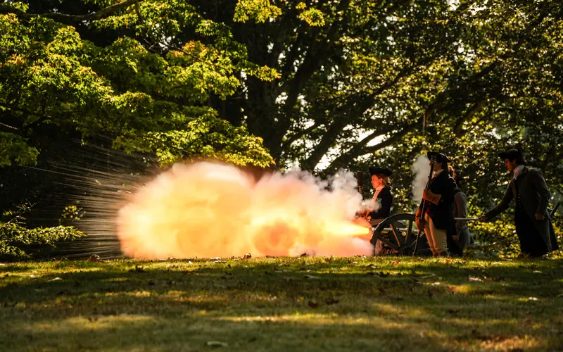A small cannon fires a large blast of flame.