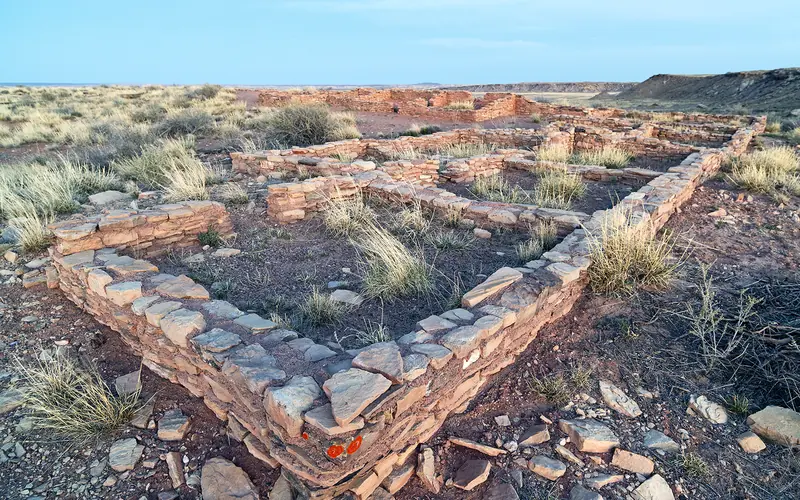 Masonry wall foundations are all that are left of a hundred room pueblo