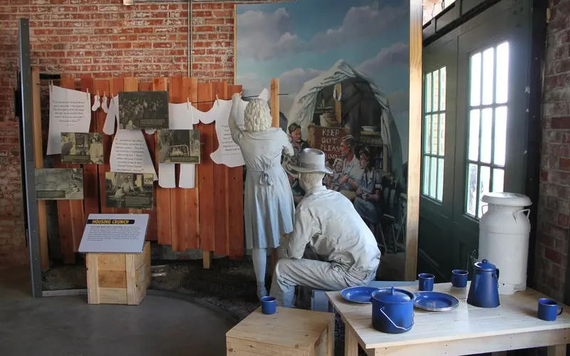 Life Cast figures on display in camping scenario.