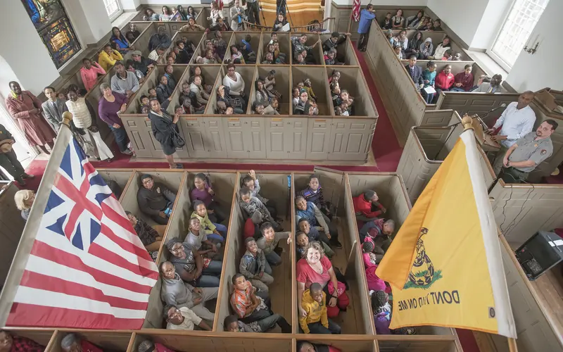 Local students gather inside Saint Paul's Church