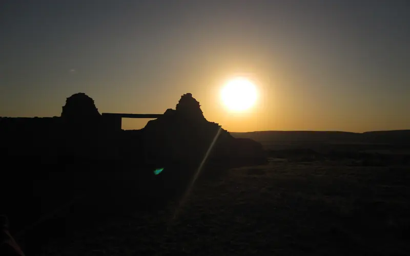 An solar eclipse outlines an old stone structure at Salinas Pueblo Missions.