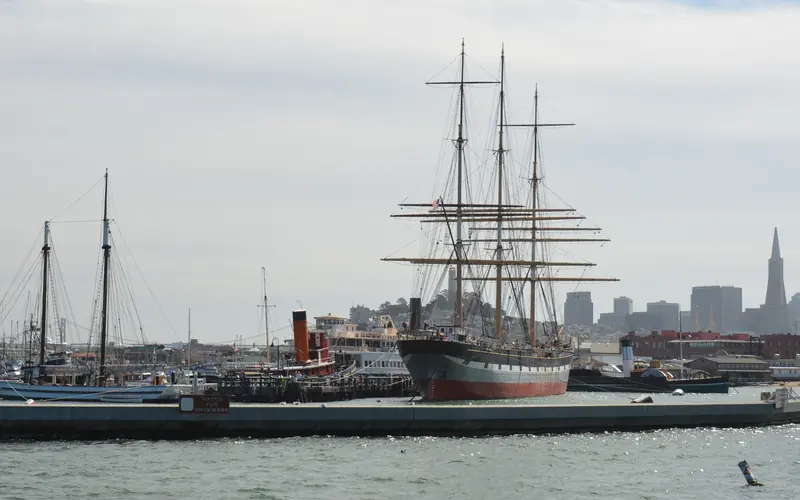 A group of vessels moored at at pier.