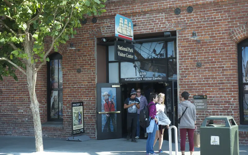 An open double door into a brick building.