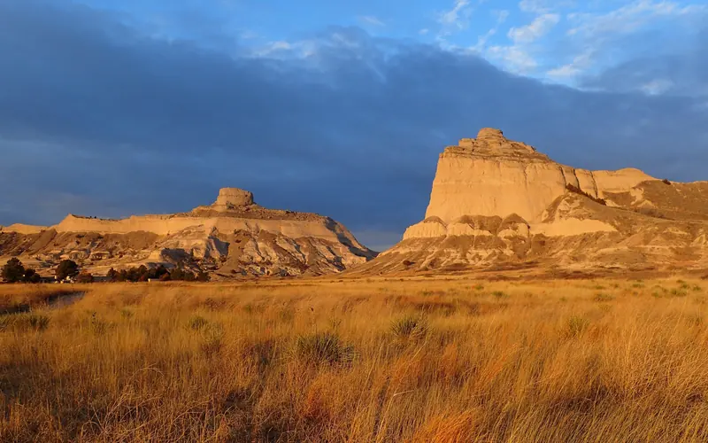 The distinctive rock formations of Mitchell Pass glow with early morning light.