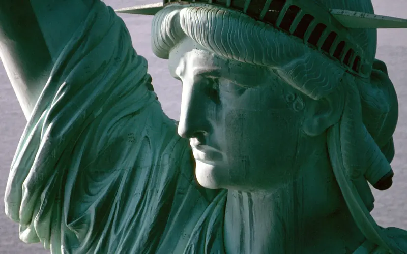 Close-up of the Statue of Liberty's head, crown, and the folds of her robe