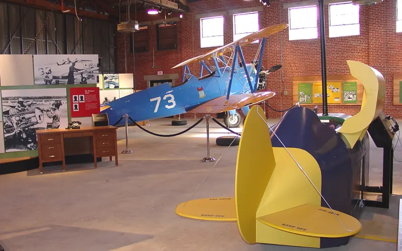 A World War II flight simulator and PT-17 bi-wing training plane