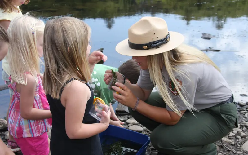 a Park Ranger shows children the wonders of nature