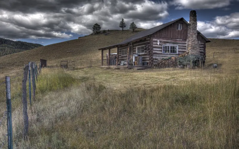 San Antonio cabin under a mostly cloudy sky