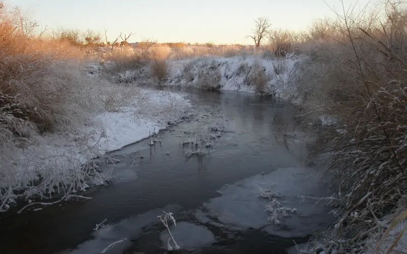 The Washita River in winter covered in ice and snow